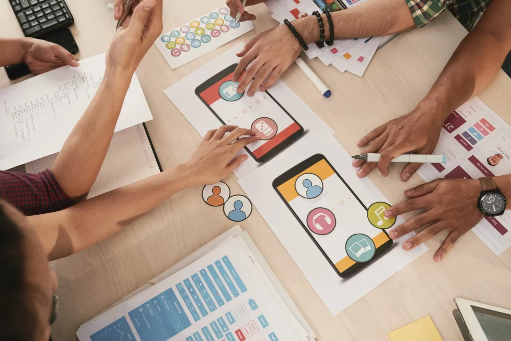 A team of front end developers deciding about icons to go with the mobile application.